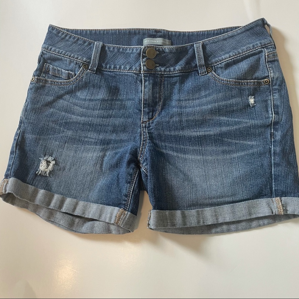Distressed denim shorts.